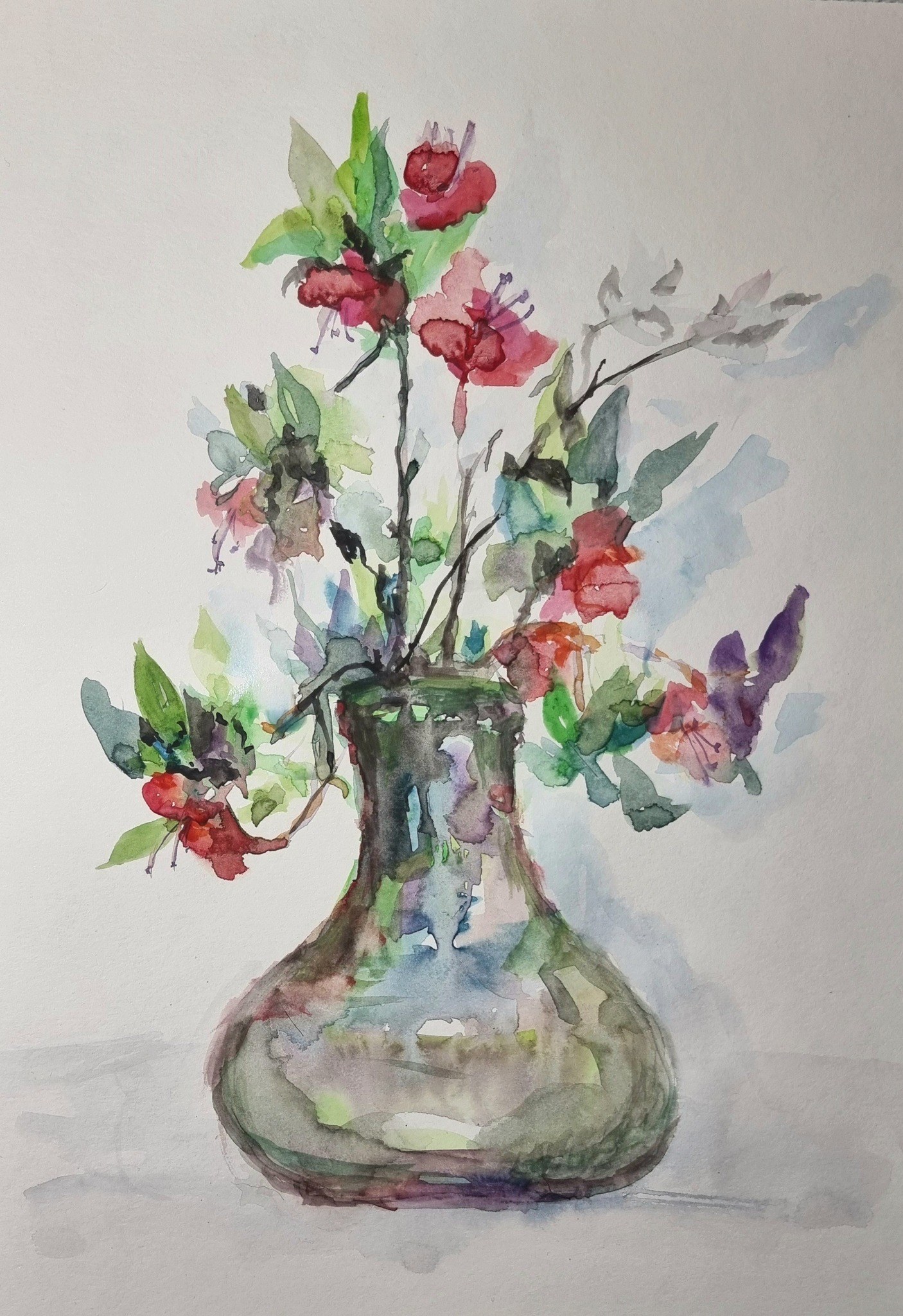 Floral still life in a transparent vase.